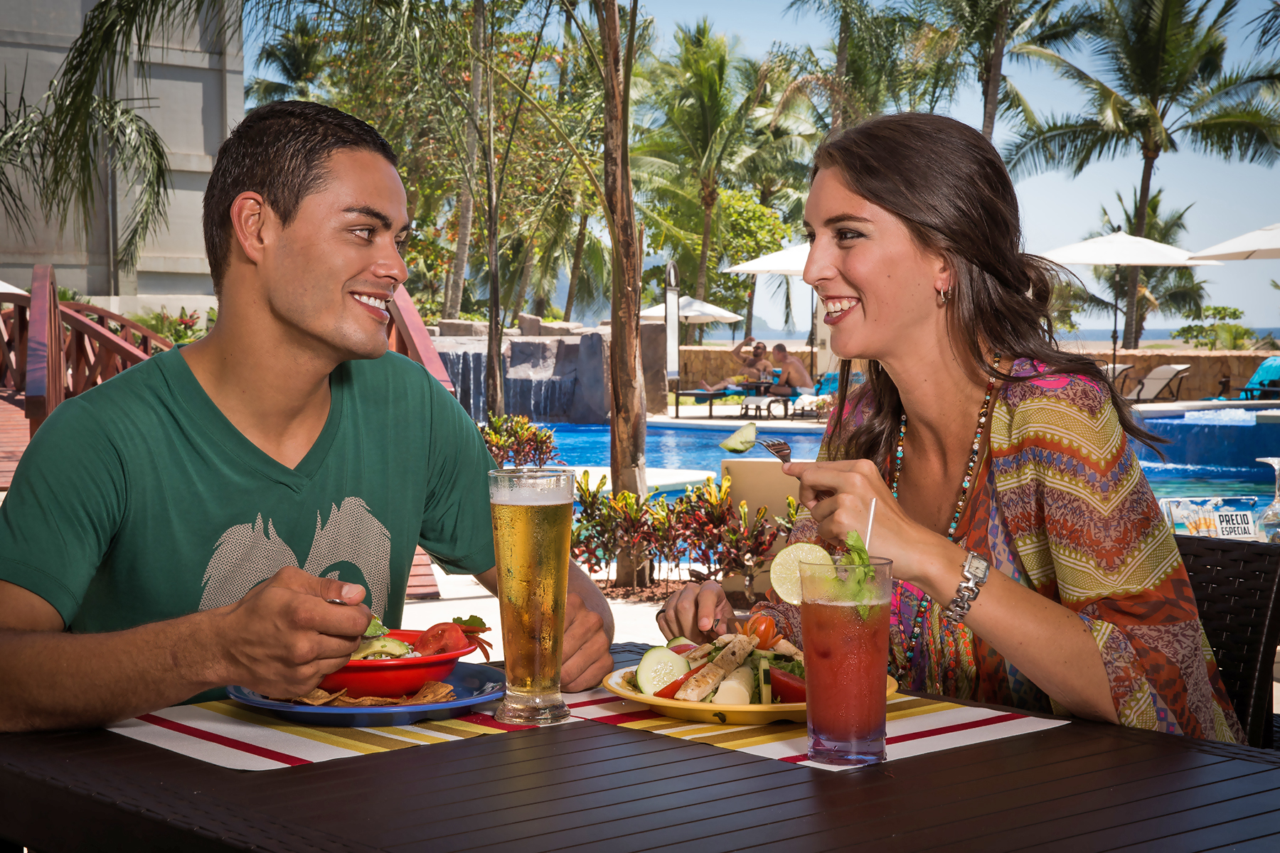 A couple enjoying lunch at the pool in Costa Rica